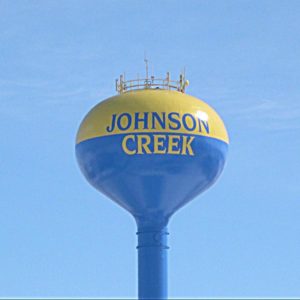 Johnson Creek Water Tower in yellow and blue