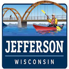 Jefferson Wisconsin Logo - Man rowing in a red kayak arch bridge in the background
